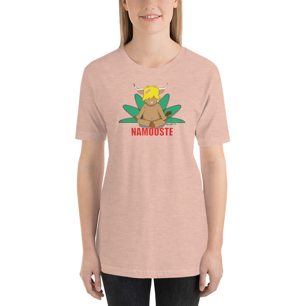 woman wearing a peach namooste highland cow t-shirt