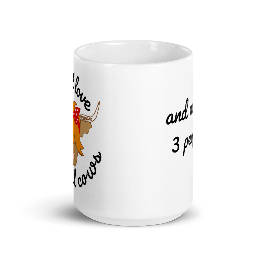 15 oz white ceramic mug with the design of a highland cow and the statement i just love highland cows and maybe three people - frontal view