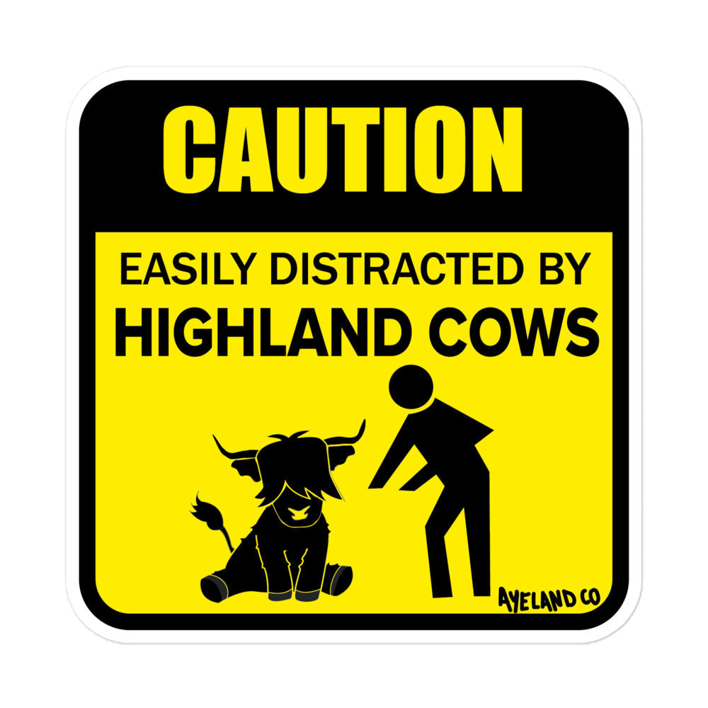 Yellow and black vinyl highland cow sticker that states easily distracted by highland cows