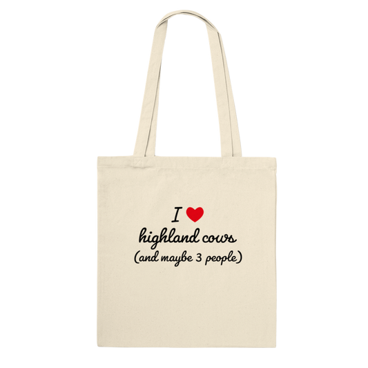 highland cow bag that states I love highland cows and maybe three people in a nice font with a red heart