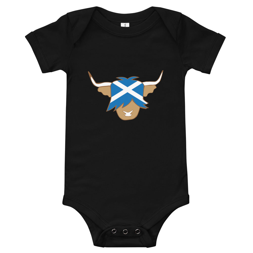 Black babygrow featuring a super cute Scottish highland cow with the flag of Scotland.