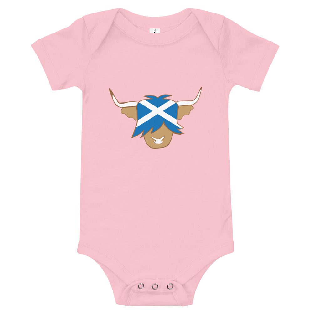 Pink babygrow featuring a super cute Scottish highland cow with the flag of Scotland.