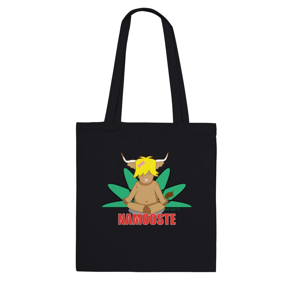 black cotton tote bag displaying a highland cow in a yoga pose stating namooste