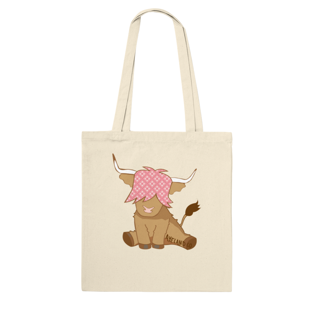 pink highland cow design on a natural cotton tote bag