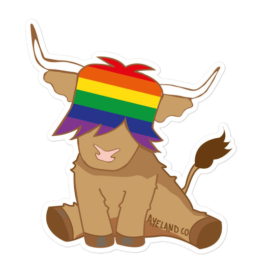 highland cow sticker with the rainbow flag in it