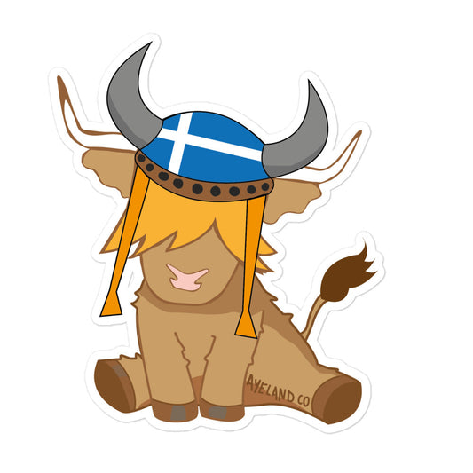 sticker of an highland cow wearing a viking hat with the flag of shetland